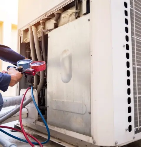 HVAC technician performing routine maintenance to prevent future air conditioning breakdowns in Dallas